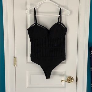 Black bodysuit with mesh paneling